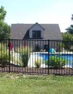 Photo: Home with ornamental aluminum fencing